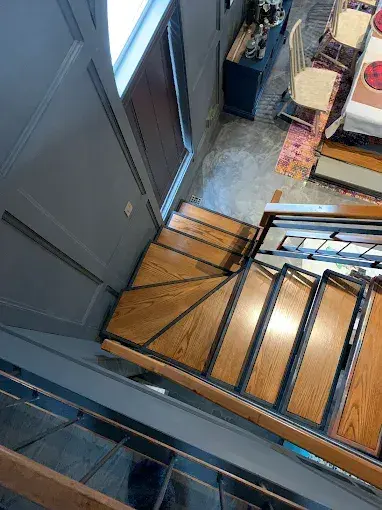 Custom oak staircase with black metal railing